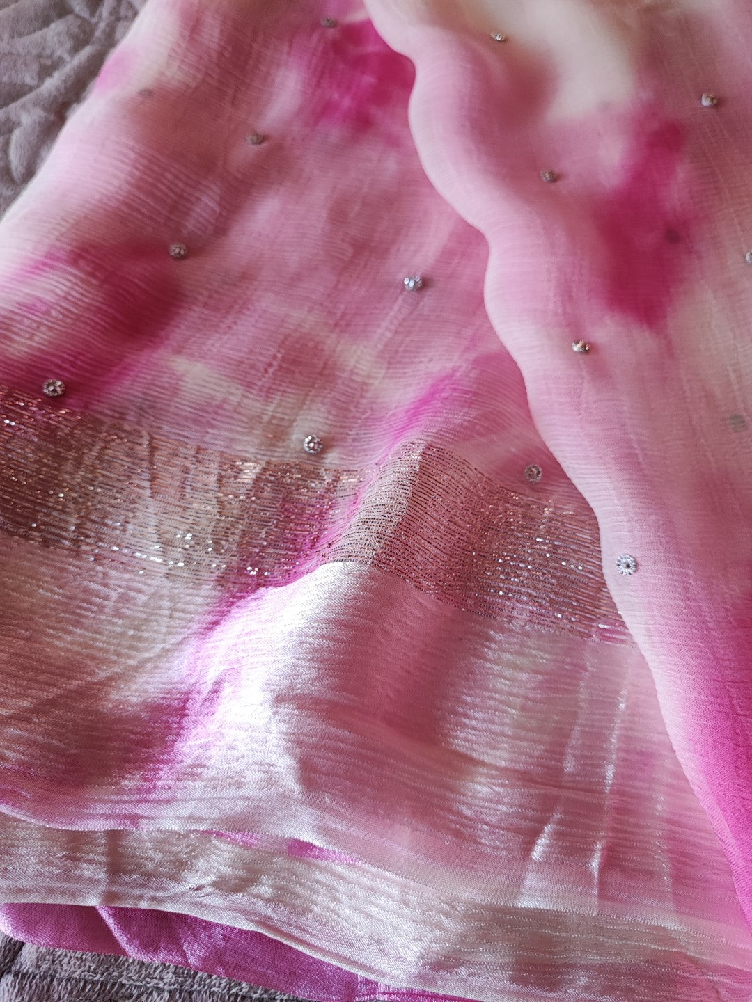 Pink Chiffon saree with silver Zari border.