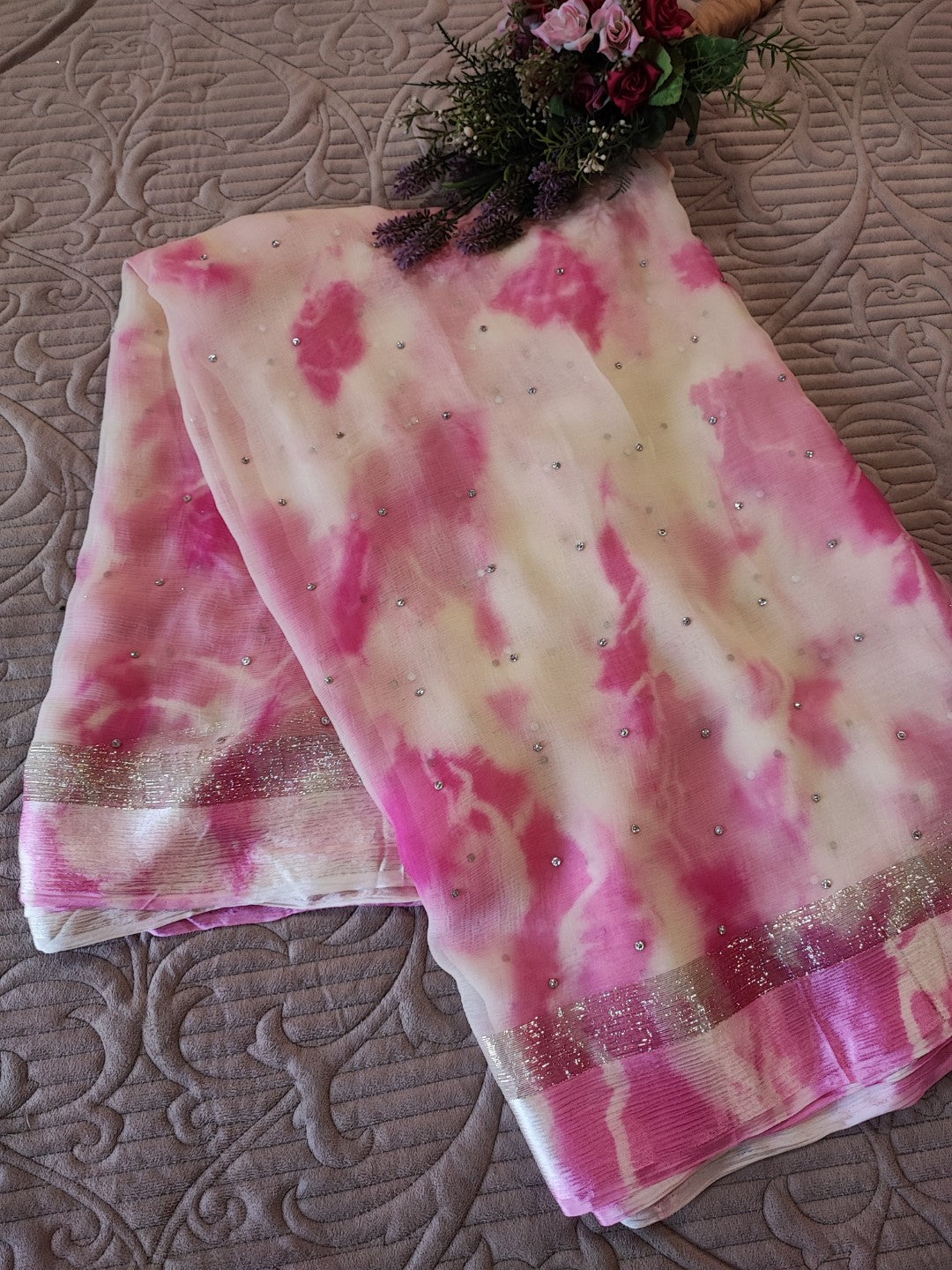 Pink Chiffon saree with silver Zari border.