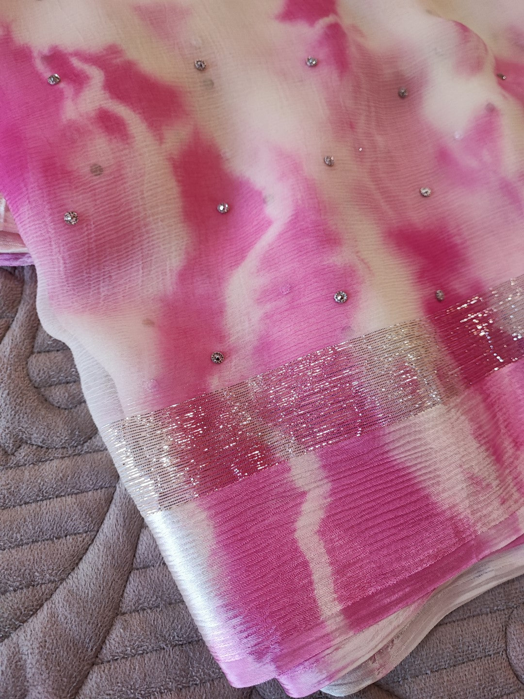 Pink Chiffon saree with silver Zari border.