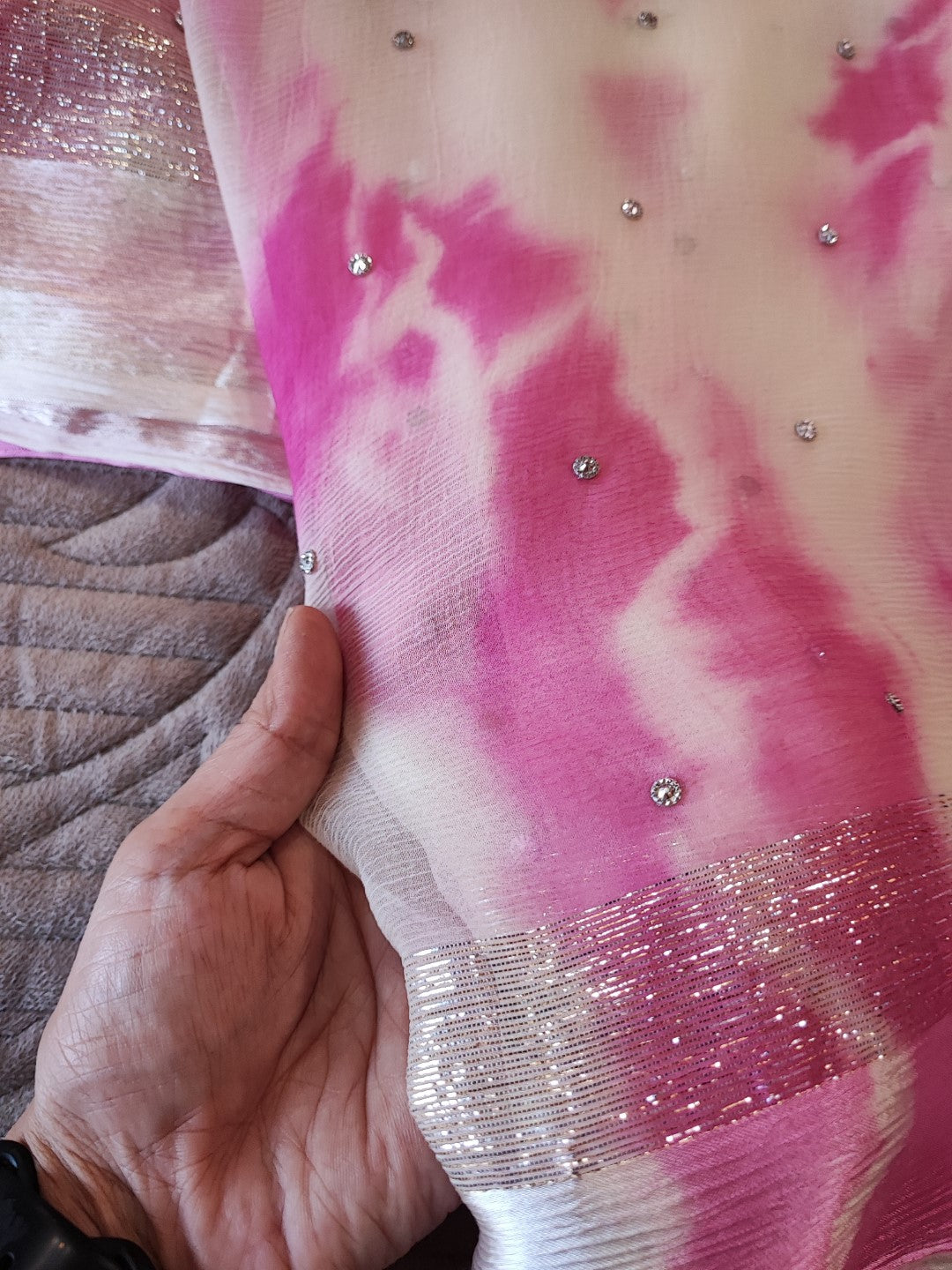 Pink Chiffon saree with silver Zari border.