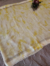 Yellow Chiffon saree with silver Zari border.