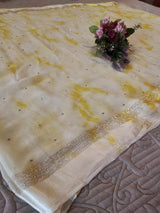Yellow Chiffon saree with silver Zari border.