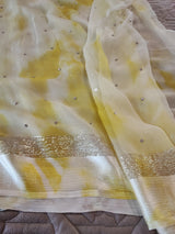 Yellow Chiffon saree with silver Zari border.