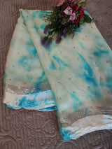 Blue Chiffon saree with silver Zari border.