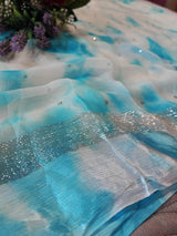 Blue Chiffon saree with silver Zari border.