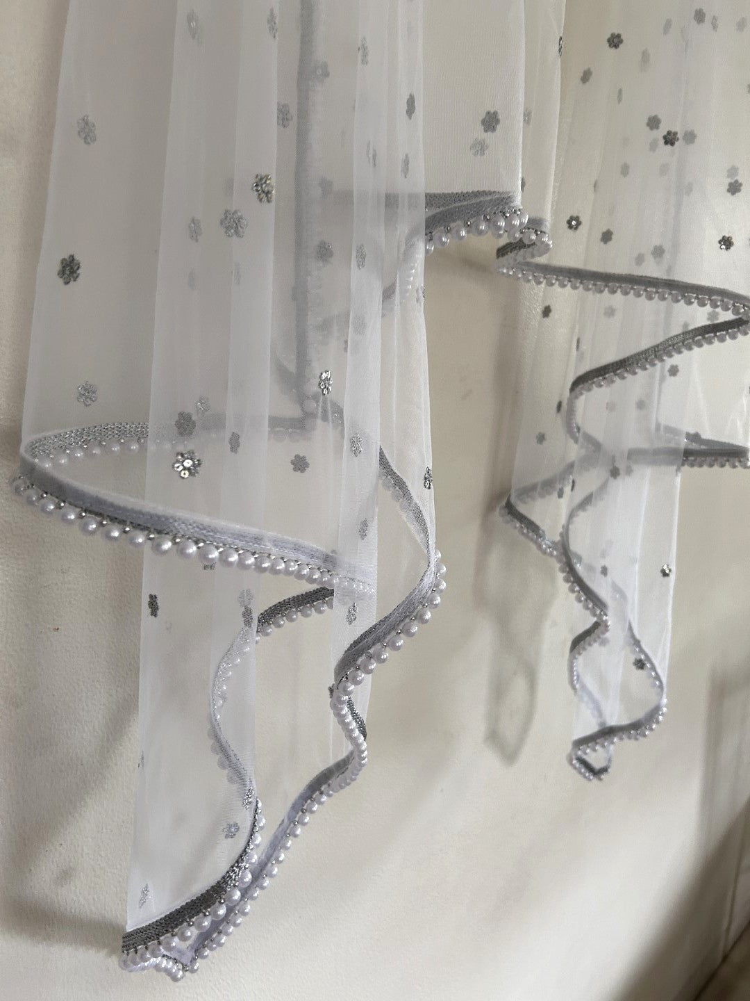 White Net dupatta with white moti border.