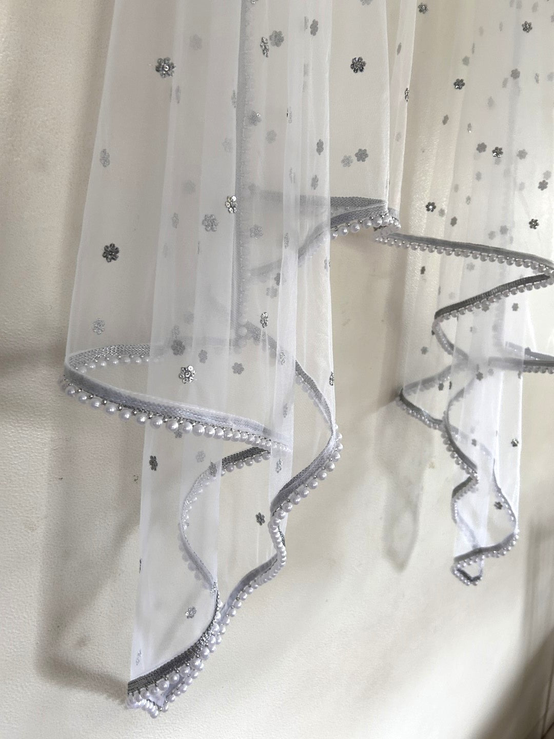 White Net dupatta with white moti border.