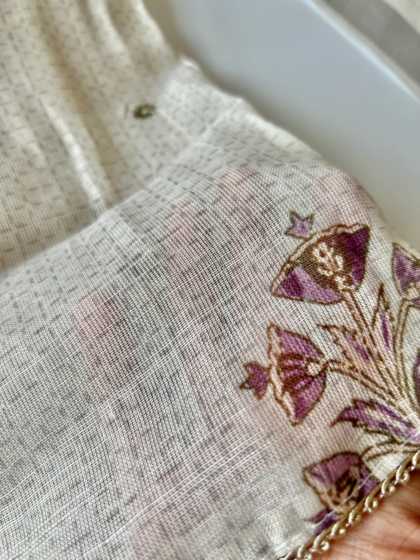 Elegant cream salwar suit set with lightweight mul linen fabric and delicate handcrafted pitta work