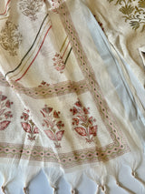 Elegant cream ethnic suit set with subtle pitta work and graceful all over prints on mul linen fabric