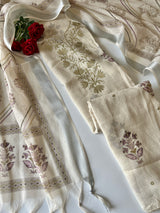 Elegant light cream dress material featuring traditional pitta work and soft breathable mul linen fabric