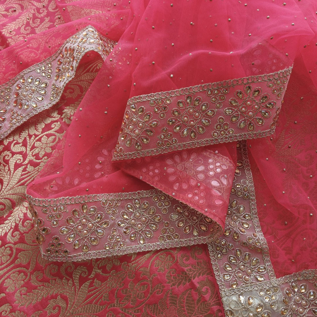 pink unstitched salwar suit with elegant brocade work and sparkling dotted dupatta