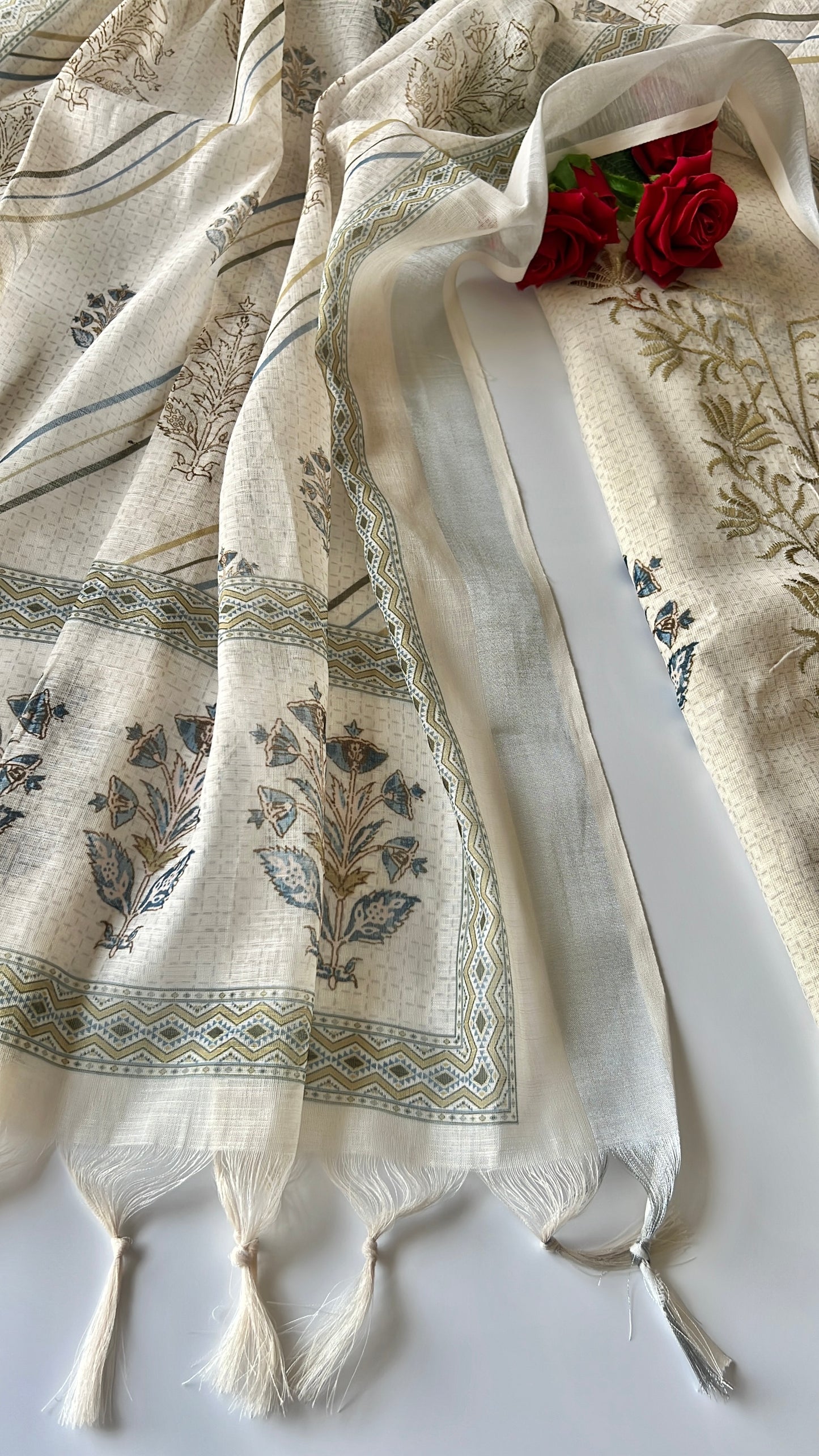 Women’s cream ethnic dress material with graceful all over prints and refined mul linen texture
