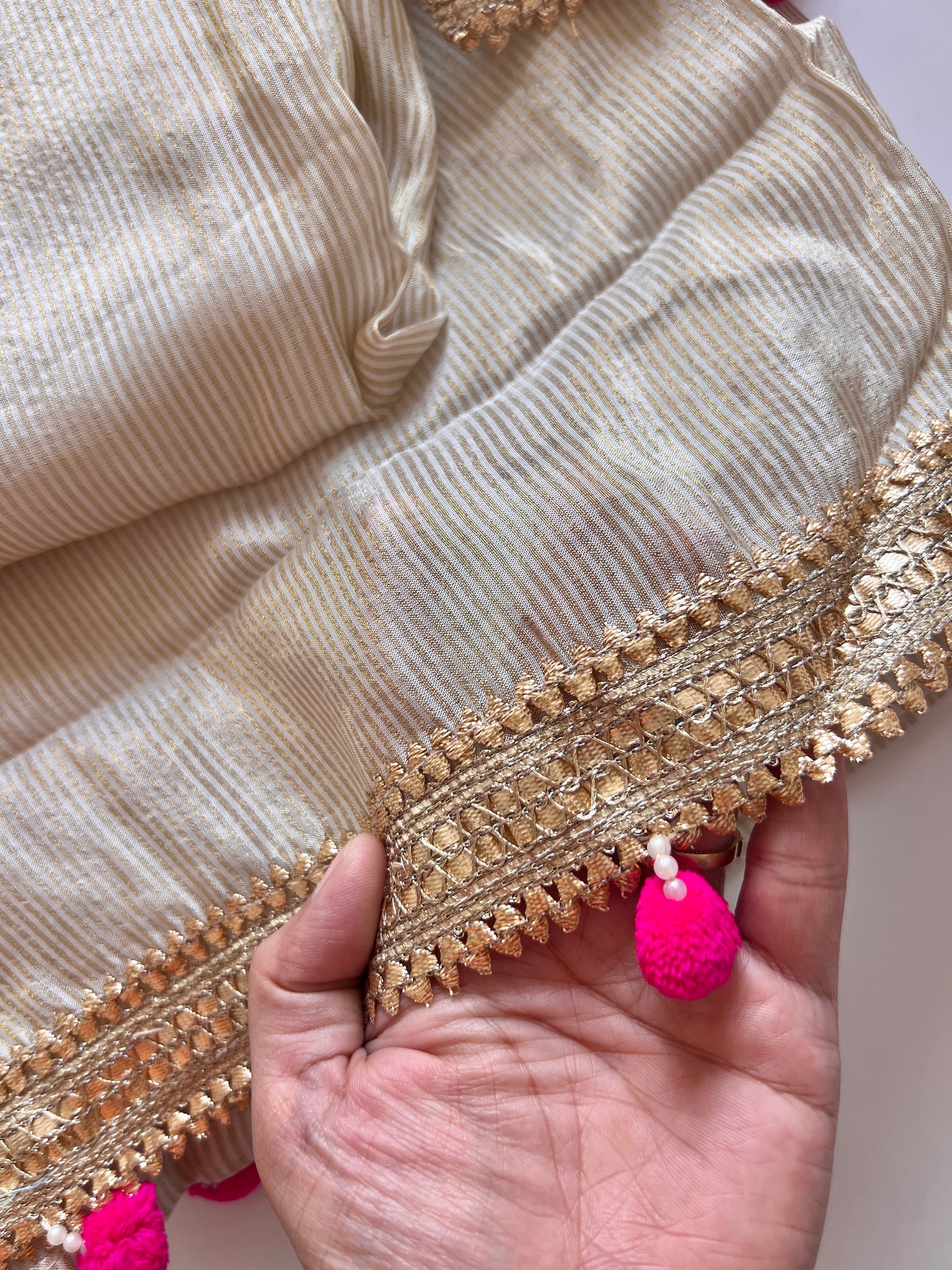 Luxury cream tissue salwar suit set with embroidered neck design and elegant pom pom latkan detailing