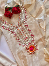 Elegant cream tissue suit material for women with subtle embroidery and festive ethnic styling