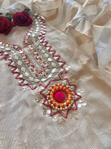 Premium cream ethnic dress material online with tissue fabric, subtle embroidery and festive pom pom accents
