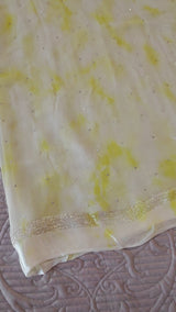 Yellow Chiffon saree with silver Zari border.