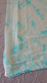 Blue Chiffon saree with silver Zari border.