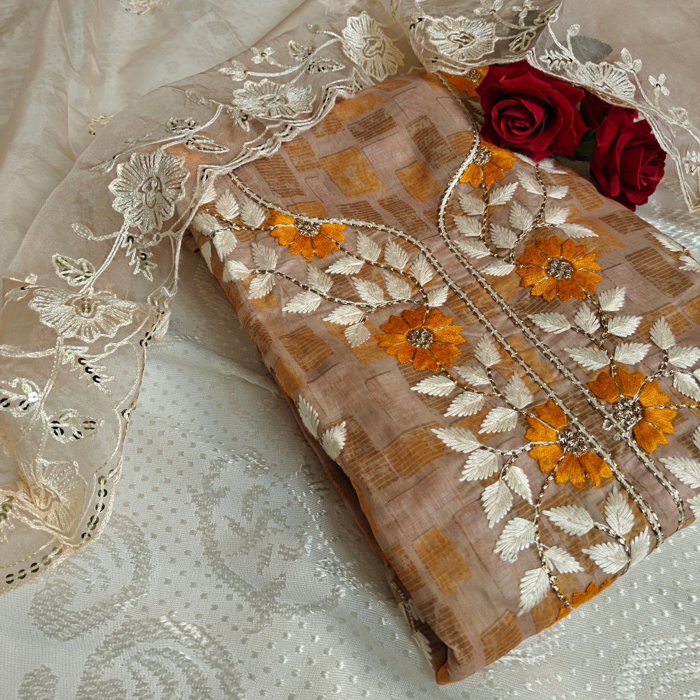 Dress material with neck embroidery